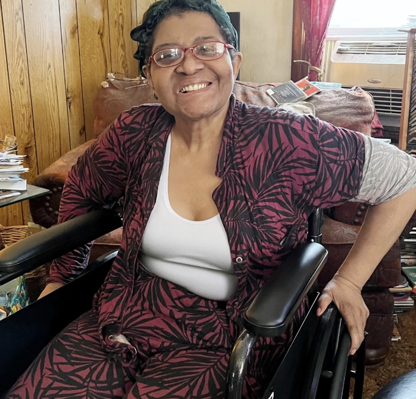 Woman smiling in a new wheelchair